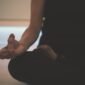 person doing yoga on floor